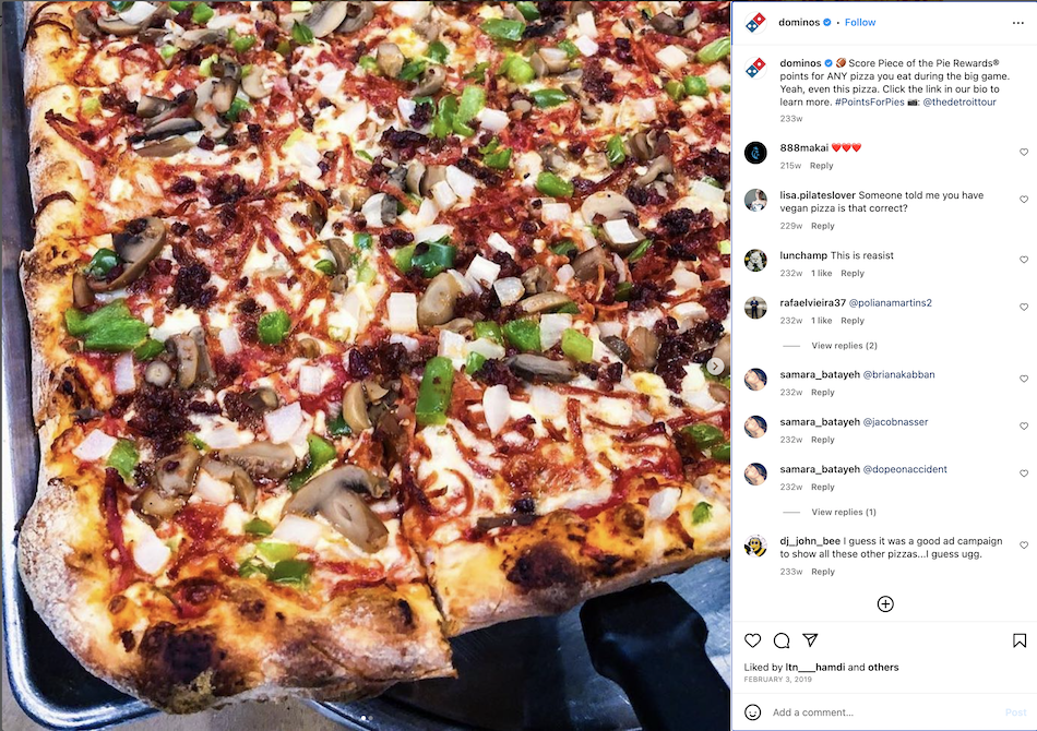 Instagram post shows close-up of a pizza pie to entice users into Dominos piece of the pie gamification campaign